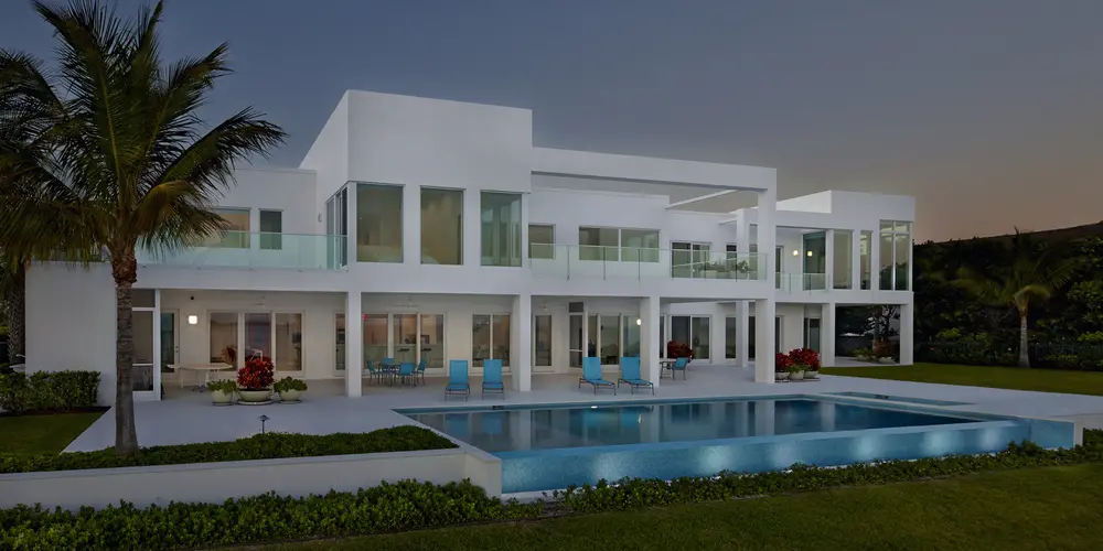 Enjoy serene poolside living with expansive terraces and modern architecture beautifully balanced by lush greenery.

