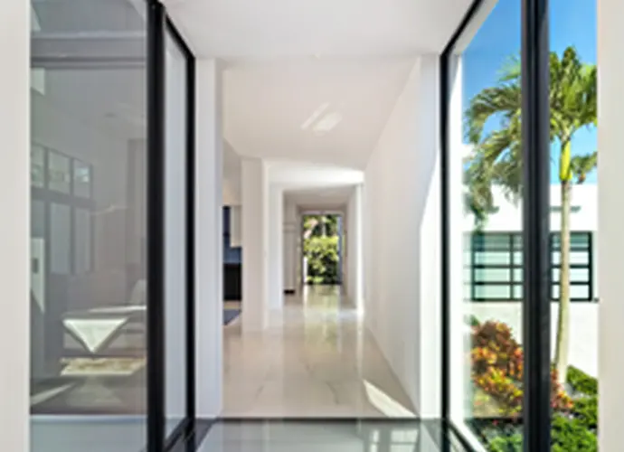 A clean-lined corridor provides both functional connectivity and aesthetic pleasure with its minimalist features and consistent daylight.