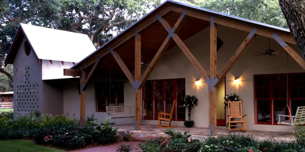 A significant visual transformation is evident, with strong timber posts supporting the porch, reflecting modern rustic charm. This curated transition incorporates natural materials while optimizing outdoor space for relaxation and entertaining.
